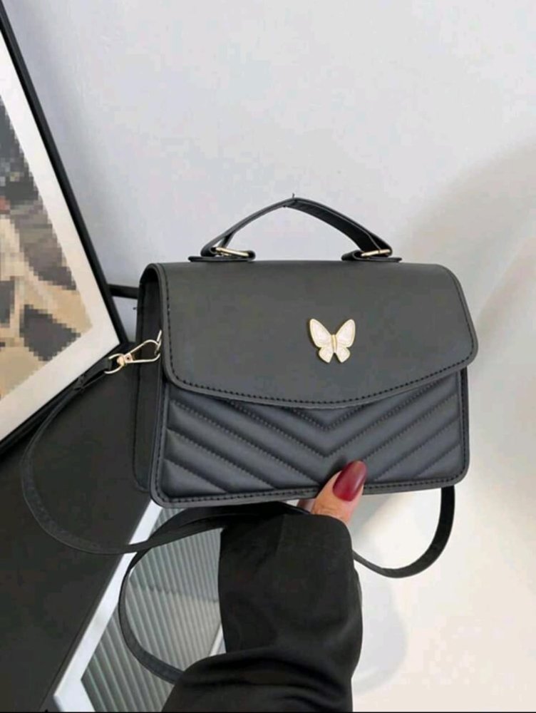 BOLSO DE MANO CON MARIPOSA