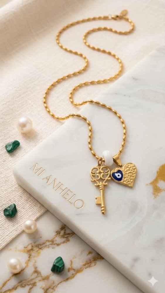 Collar con dije de llave y corazon con ojo turco incrustado