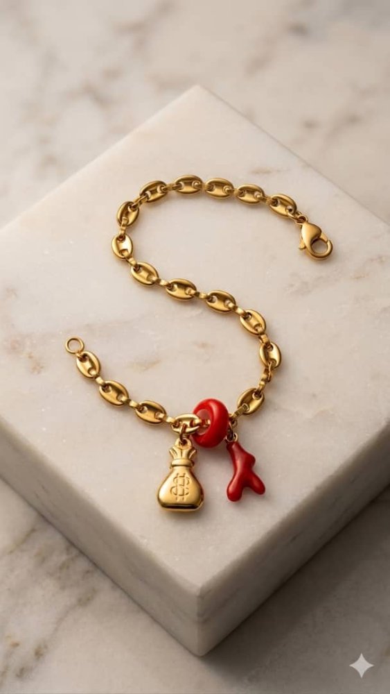 Pulsera gucci con dije de bolsita y rama roja