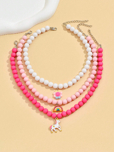 Collar de perlas por unidad (tonos rosados con dije de arcoiris, blanco con dije de flor)