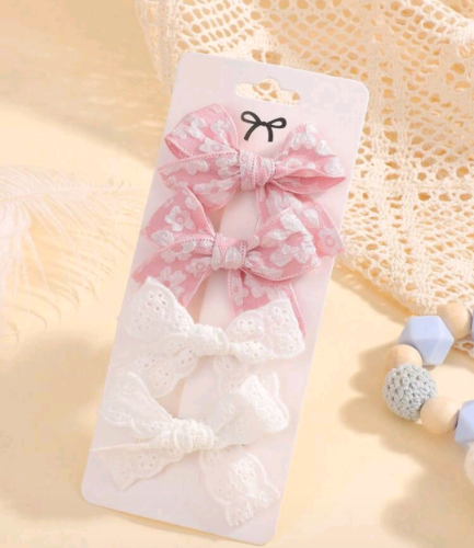 Paq 2 pares de lazos blanco y rosa