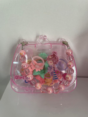 Cartera tipo estuche de colitas diseño lazos