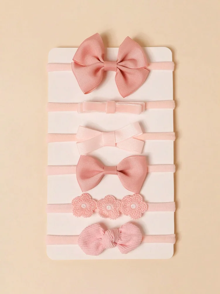 Set 2 Cintillos de elastica suave con detalle en tono rosado