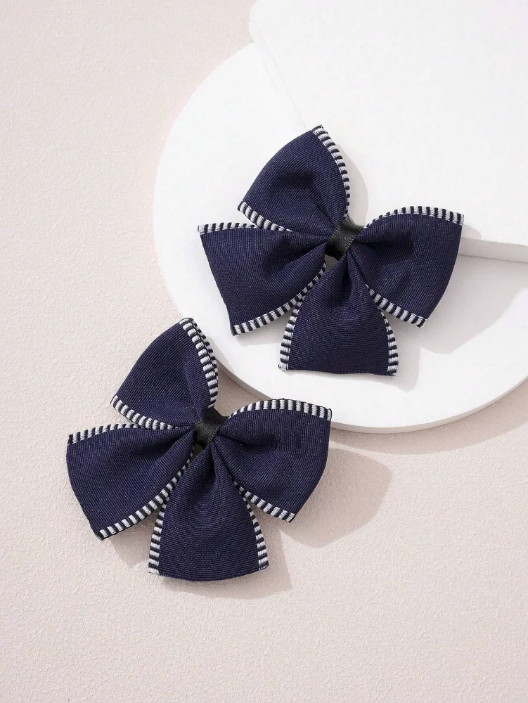 Par de Lazos azul oscuro con detalles blancos