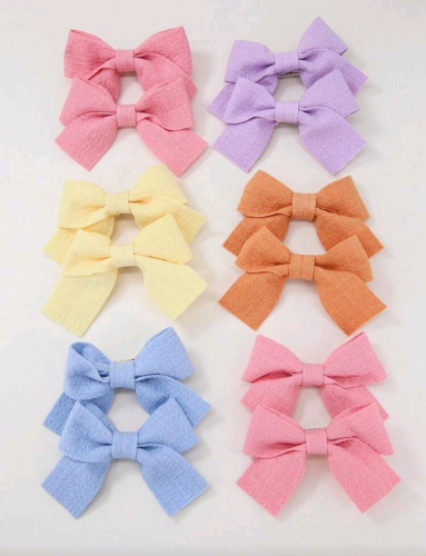 Par de lazos de telas colores pasteles para bebe
