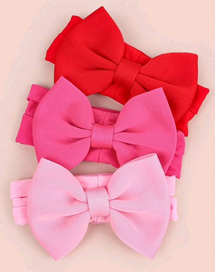 Cintillo de elastica suave ancha con lazo rosado, fucsia y rojo