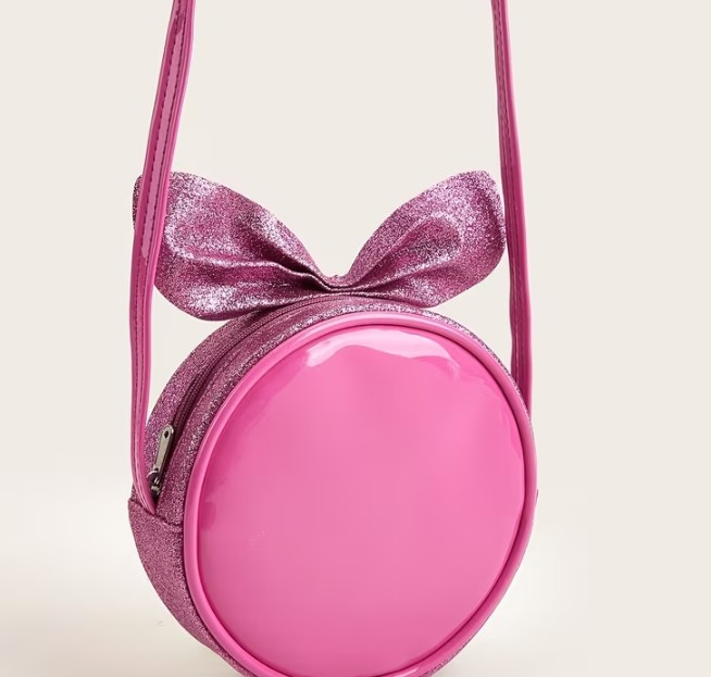 Cartera circular fucsia con lazo