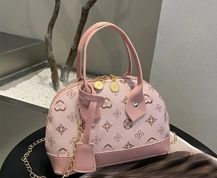 Cartera tipo baul rosada
