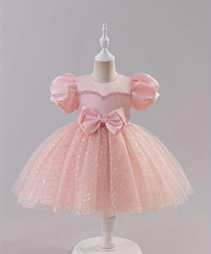 VESTIDO ROSA FALDA DE LENTEJUELAS MOÑO CINTURA