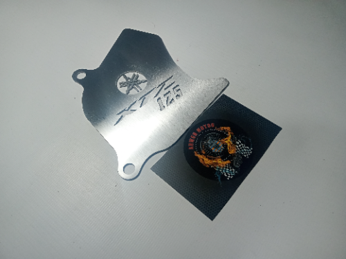 TAPA PIÑÓN XTZ125 - PERFORADO