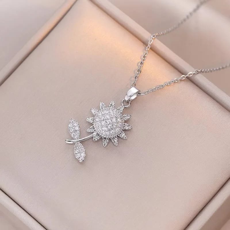 COLLAR GIRATORIO FLOR ACERO INOX. SILVER