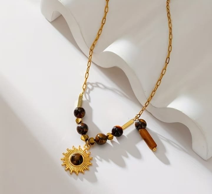 COLLAR OJO DE TIGRE SOL ACERO INOX.