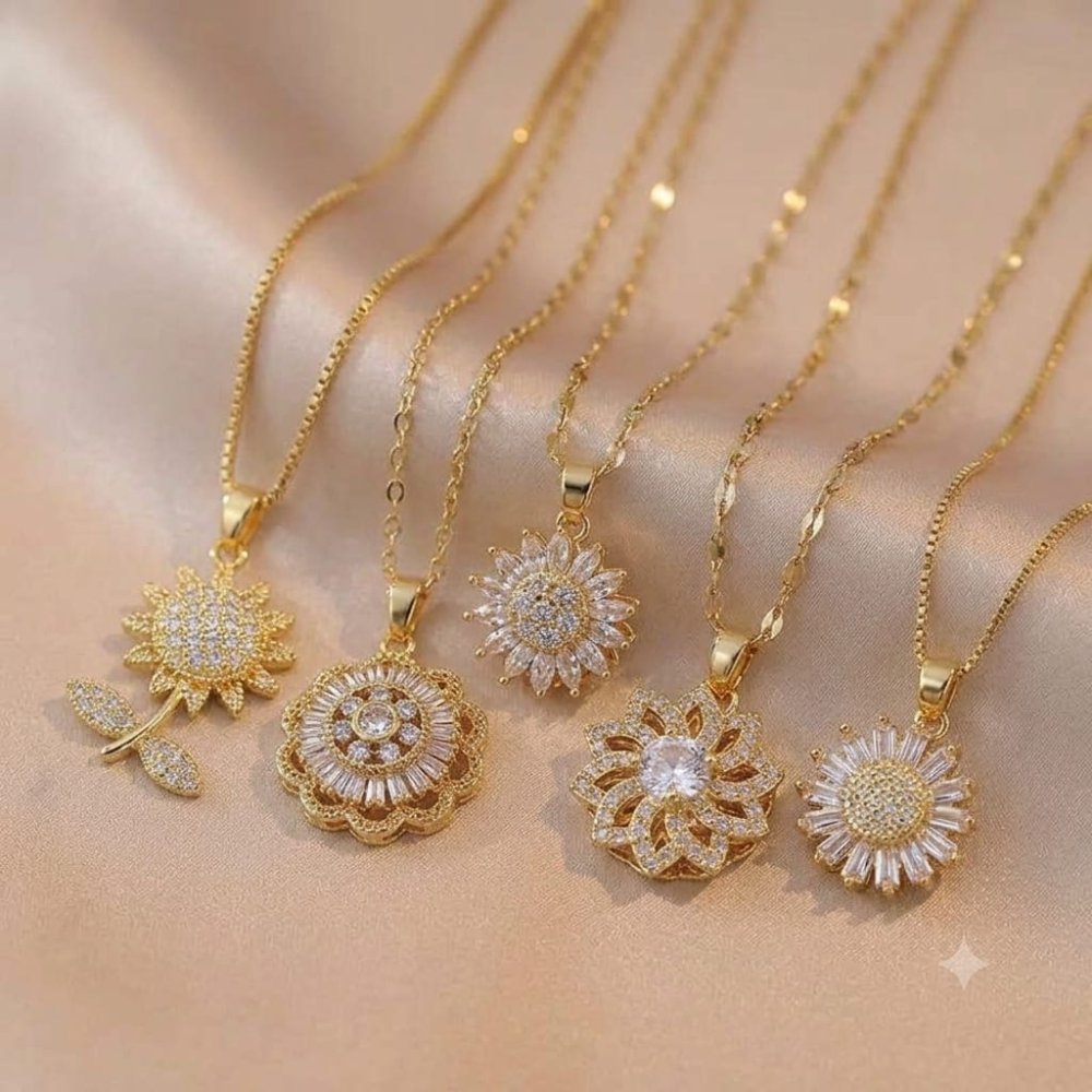 COLLAR GIRATORIO FLOR ACERO INOX. GOLD