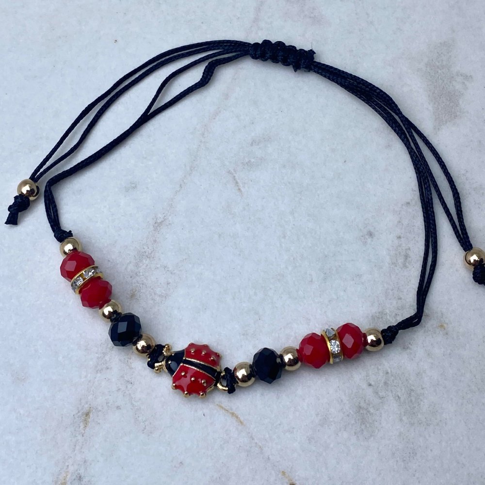Pulsera / tobillera regulable de hilo - vaquita de san antonio negro