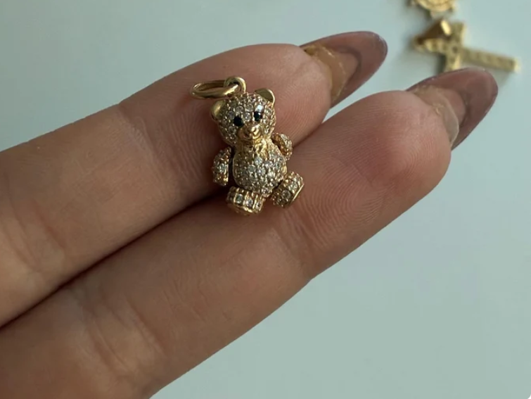 DIJE MINI OSO ARTICULADO OJOS NEGROS PIEDRAS BLANCAS 1.9CM ORO AMARILLO COL 18K - 2,57GR