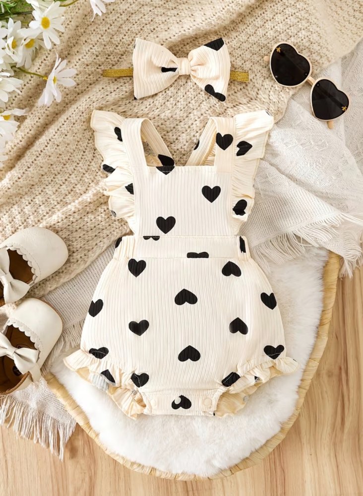 Mameluco blanco con corazones oscuros