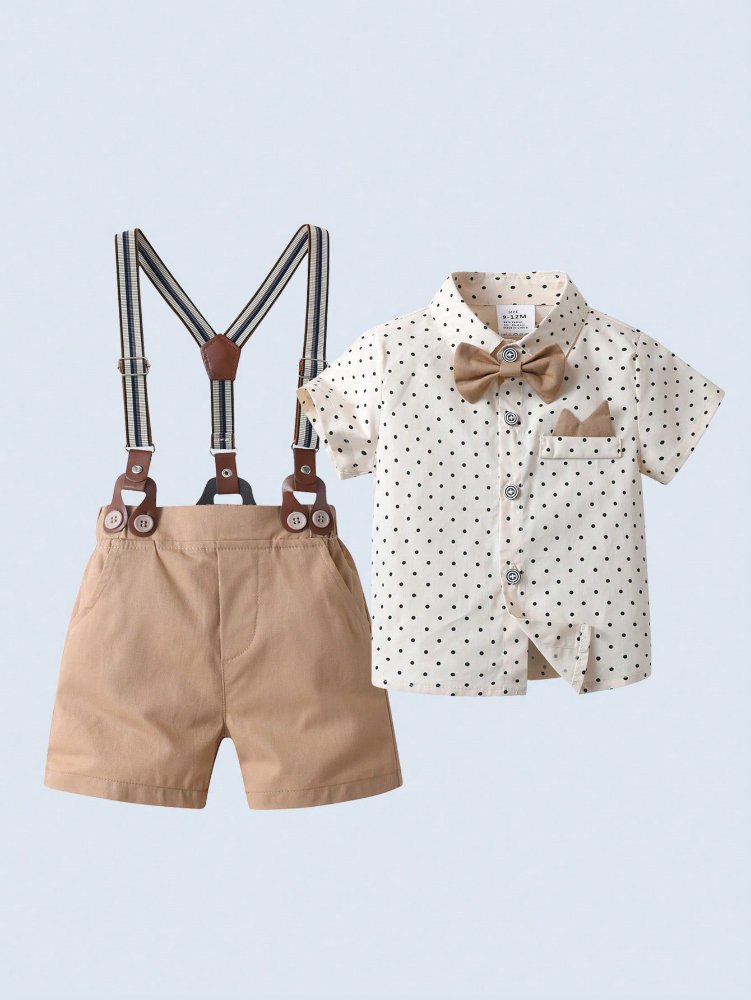 Traje de niño, traje de short crema, camisa crema con puntos café manga corta, tirantes rayados crema con café y corbatín crema