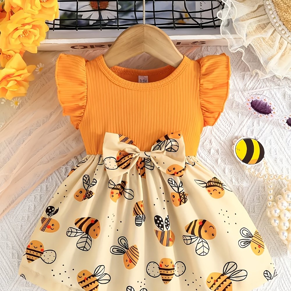 Vestido de niña, vestido parte superior naranja, parte inferior estampado de abejitas, lazo en la cintura