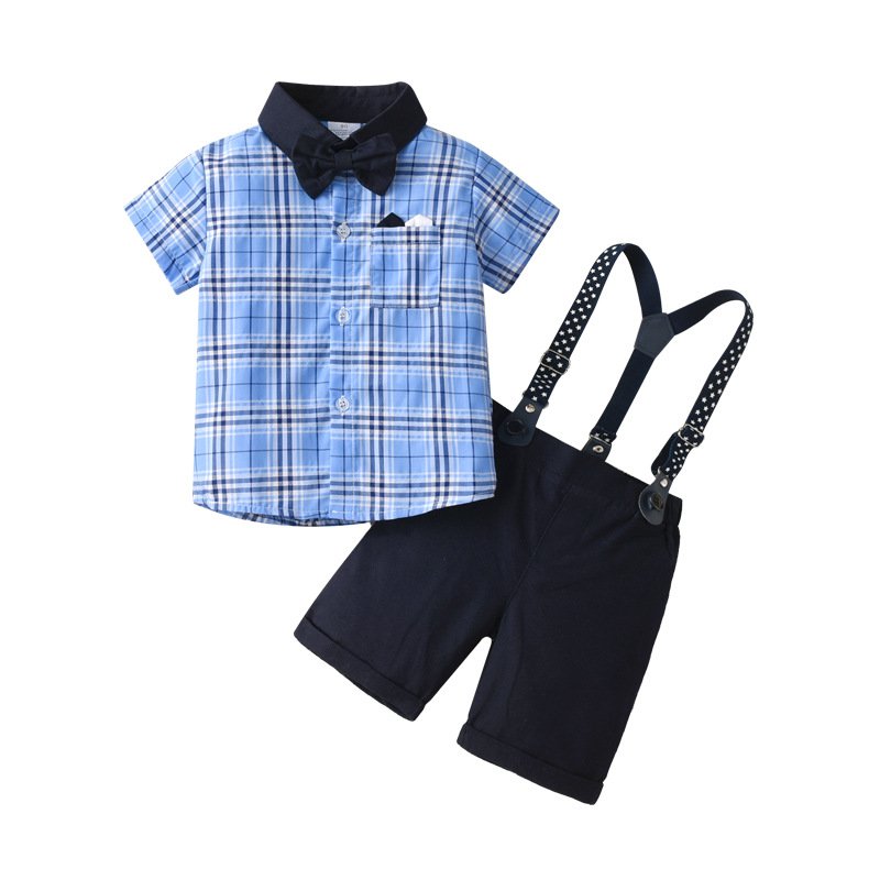Traje de niño, traje de short negro, camisa celeste cuadrado con cuello azul, tirante negro con estrellas, corbatín azul