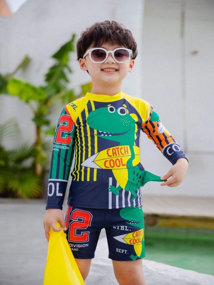 Traje de baño de niño, azul con verde, amarillo y dibujo de dinosaurio con tabla de surf