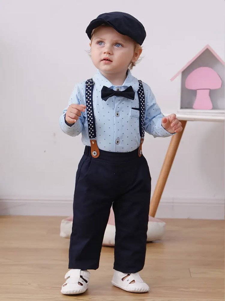 Traje de niño, traje de pantalón azul, camisa celeste con estrellitas, tirante negro con estrellas blancas y corbatín negro