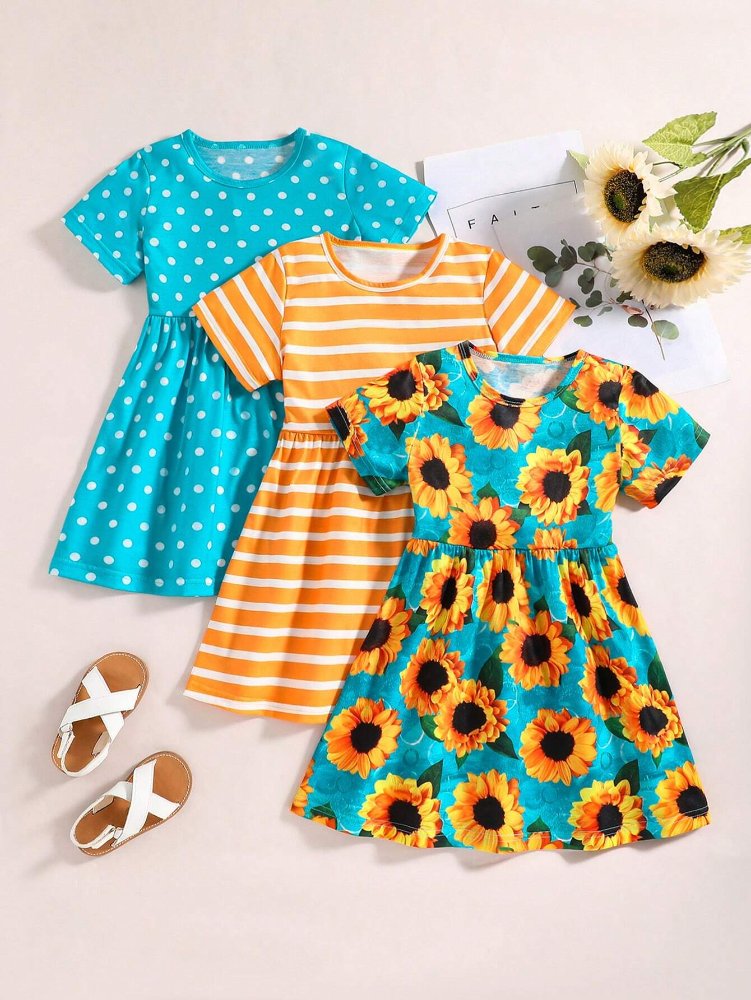 Set de niña, vestido celeste con figura de girasol, celeste con puntos blancos y naranja con rayas blanca