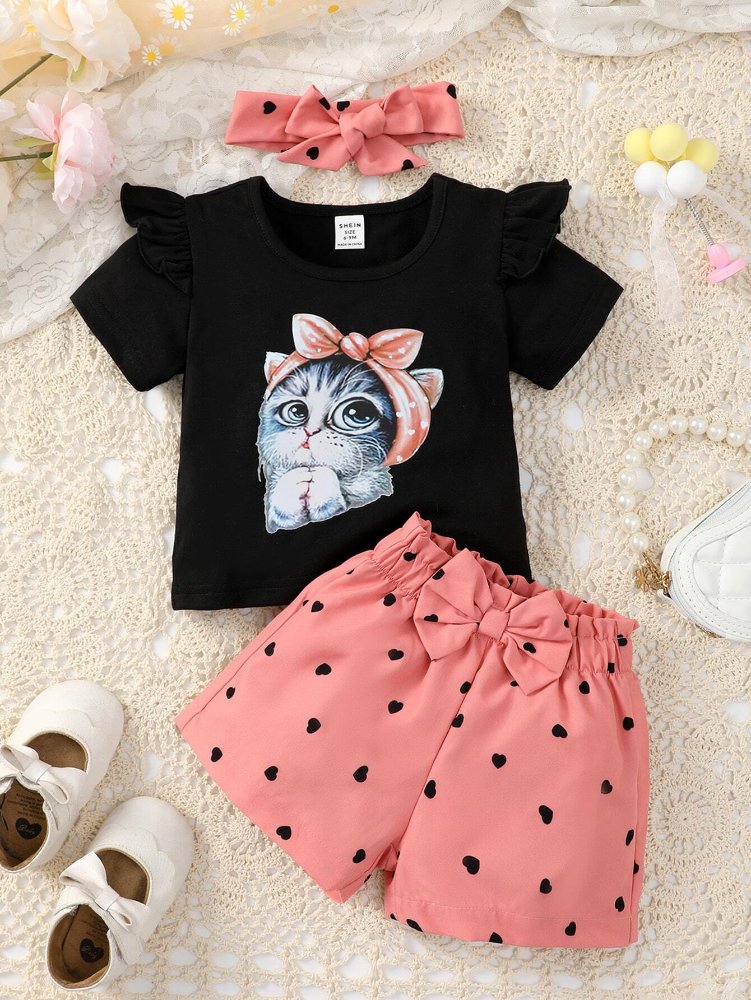 Traje de niña, traje de short rosado con punto negro, camisa negra con figura de gatita y cintillo rosado con punto negro