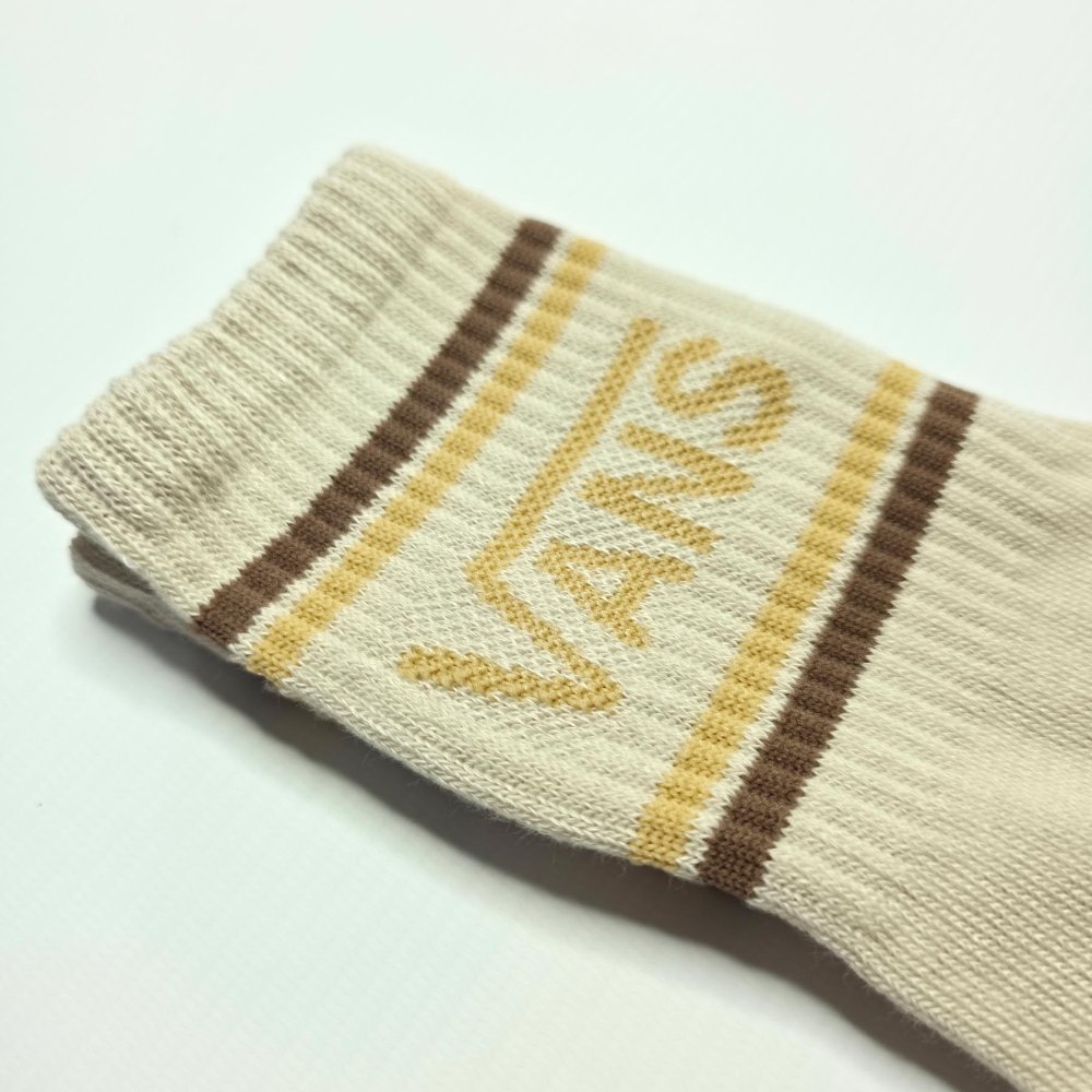 Vans beige, líneas marron